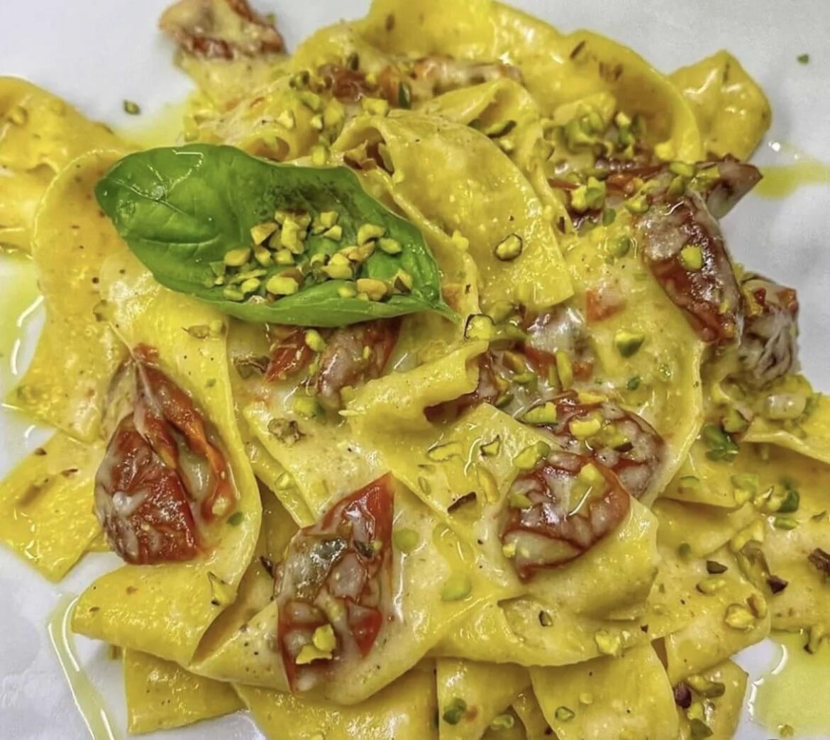 Tagliatelle with provola cheese, dried tomatoes and chopped pistachios