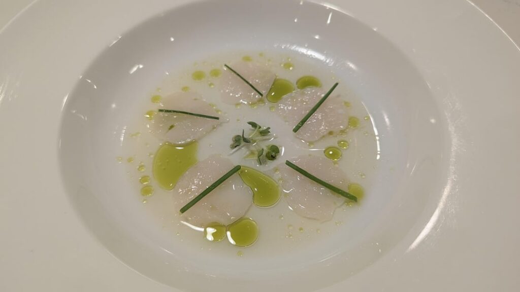 Scallop crudo with yuzu, mirin and herb oil