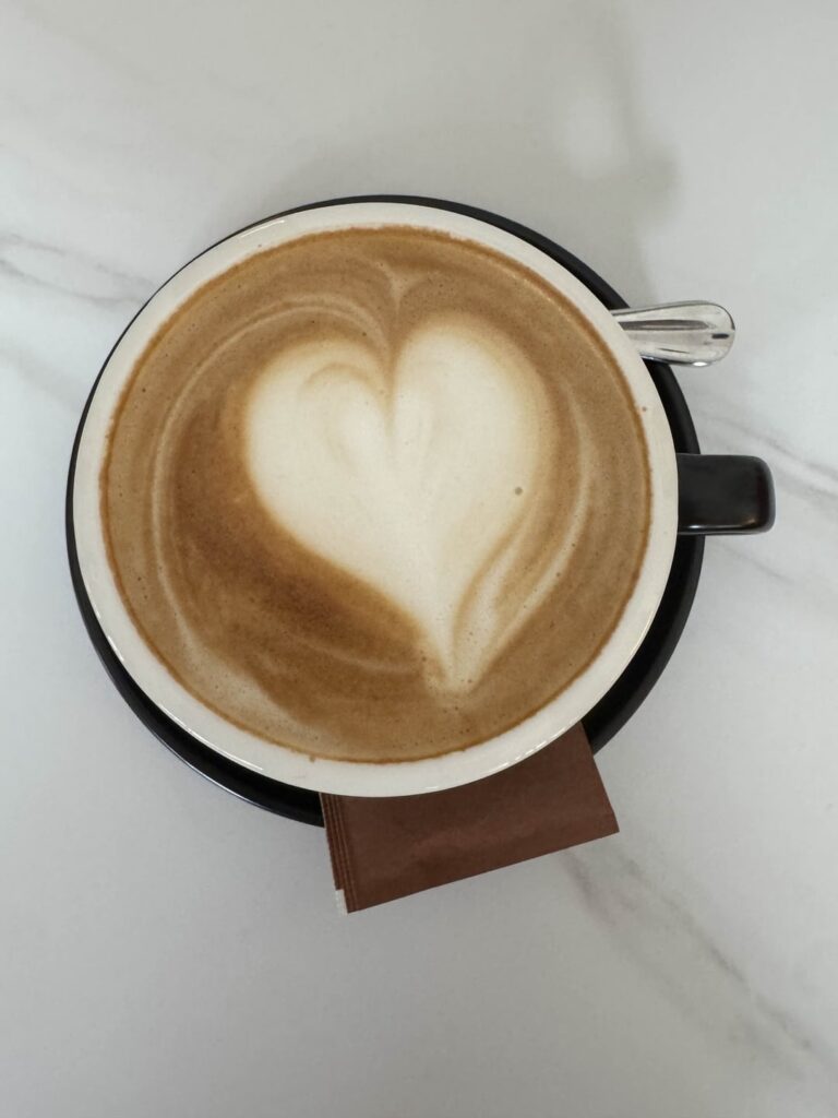 My latte art sinks after 2 minutes and dissolves with bubbles. What am I doing wrong?