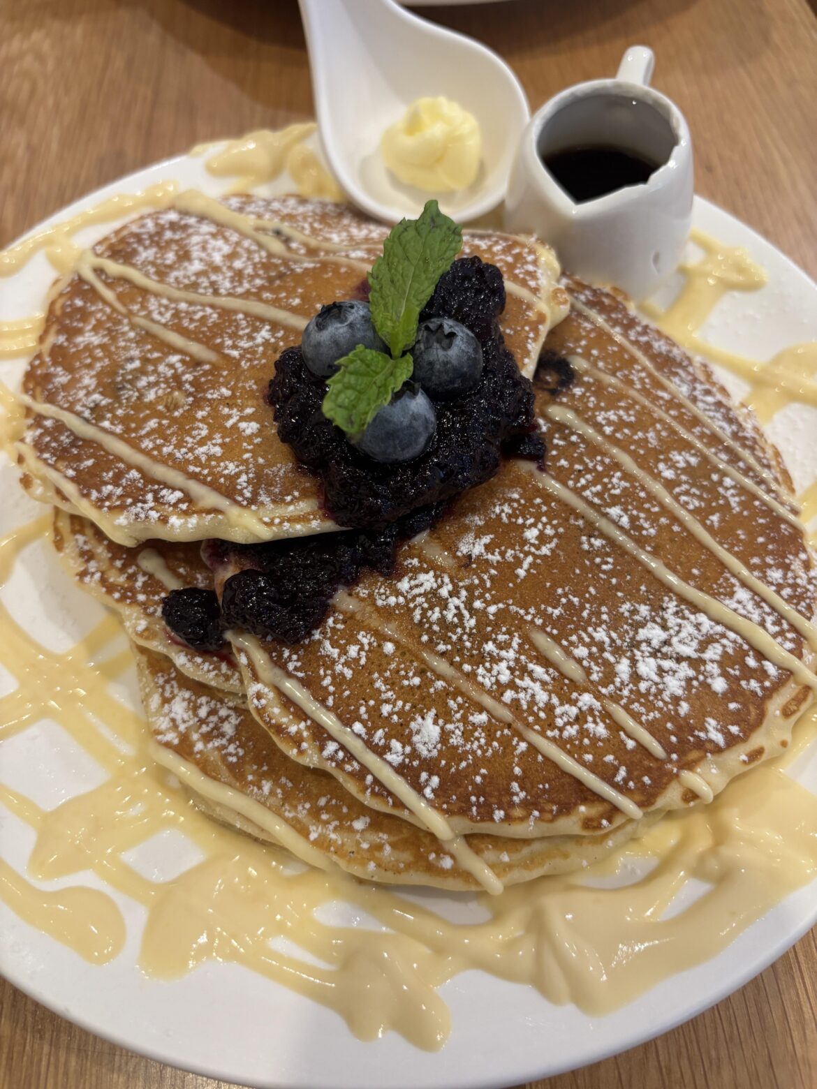 Blueberry pancakes layered with blueberry compote and vanilla custard
