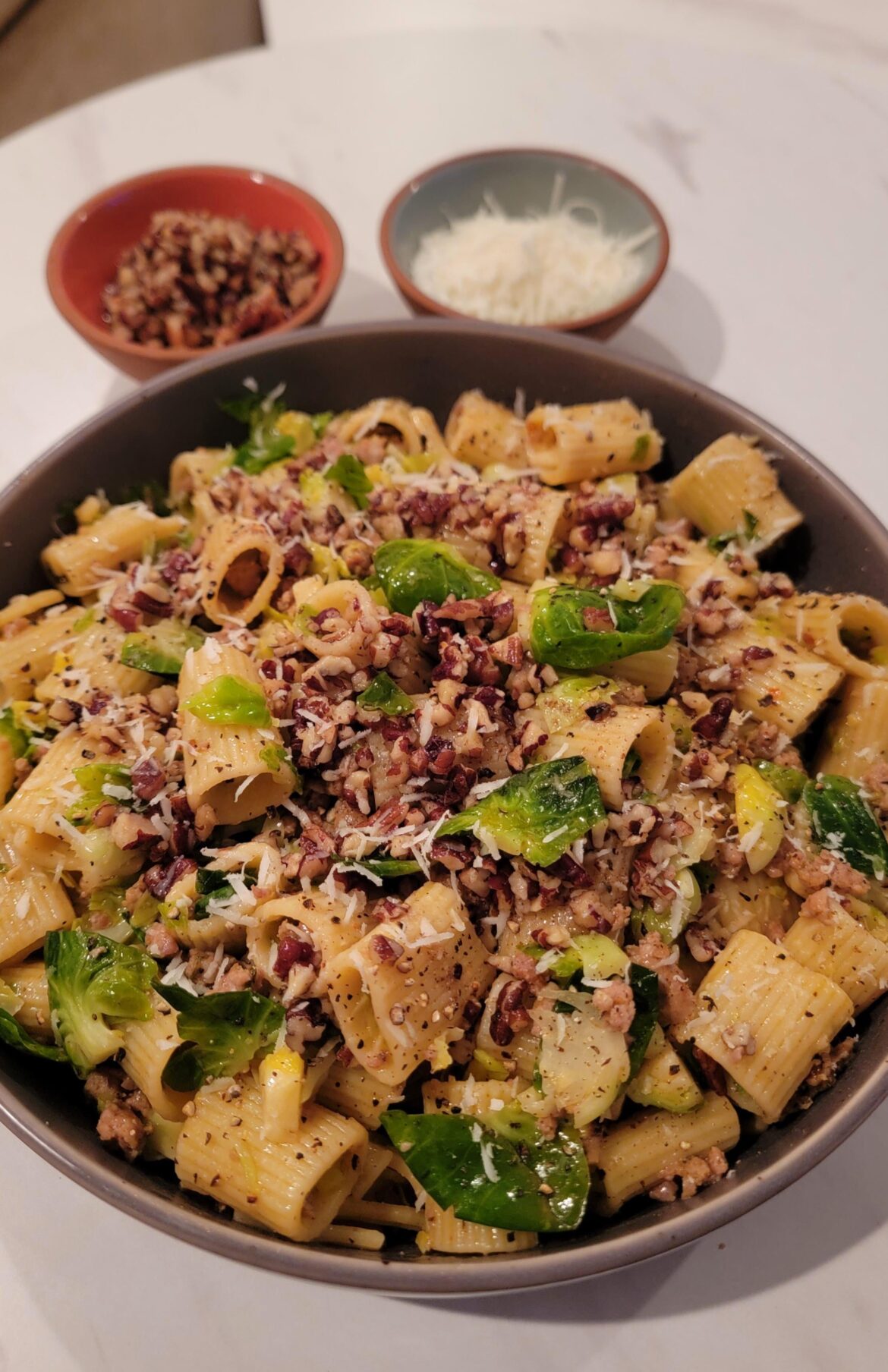 [Homemade] Rigatoni With Sausage, Brussel Sprouts, and Chili-Butter Pecan Topping