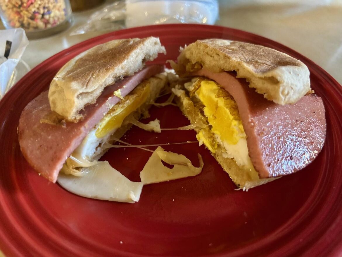Bologna, Egg, and Gruyère on a buttered toasted muffin