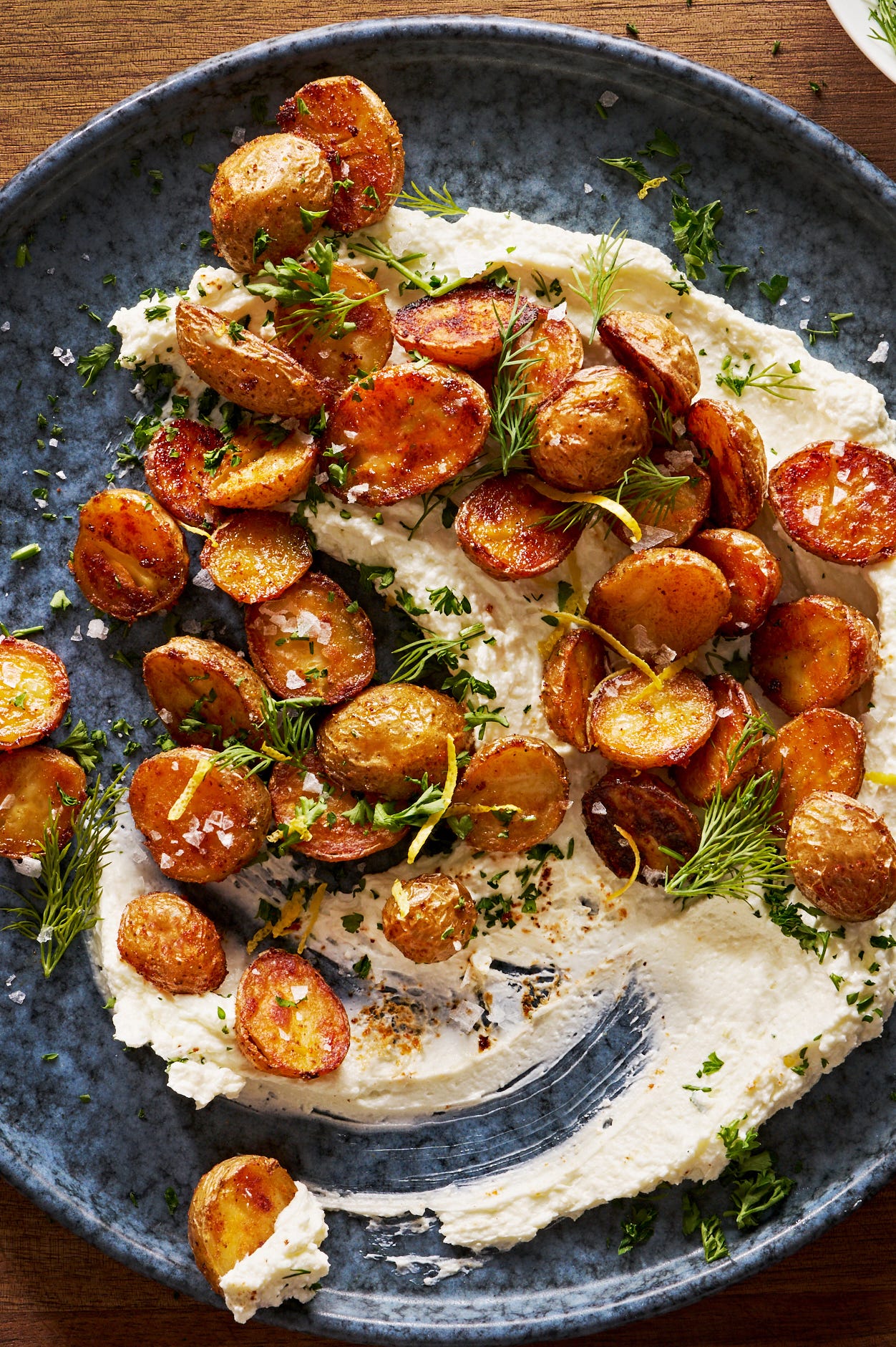 whipped feta topped with crispy roasted potatoes
