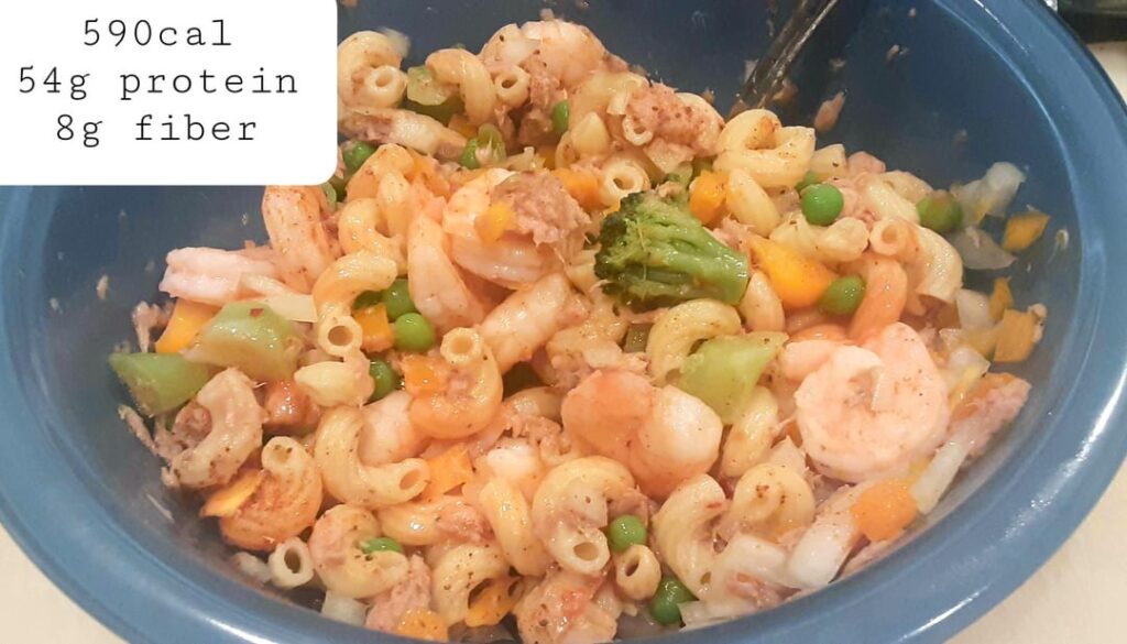 "Seafood" macaroni salad. Over 1lb of food for 590 calories, 54g of protein, and 8g of fiber.