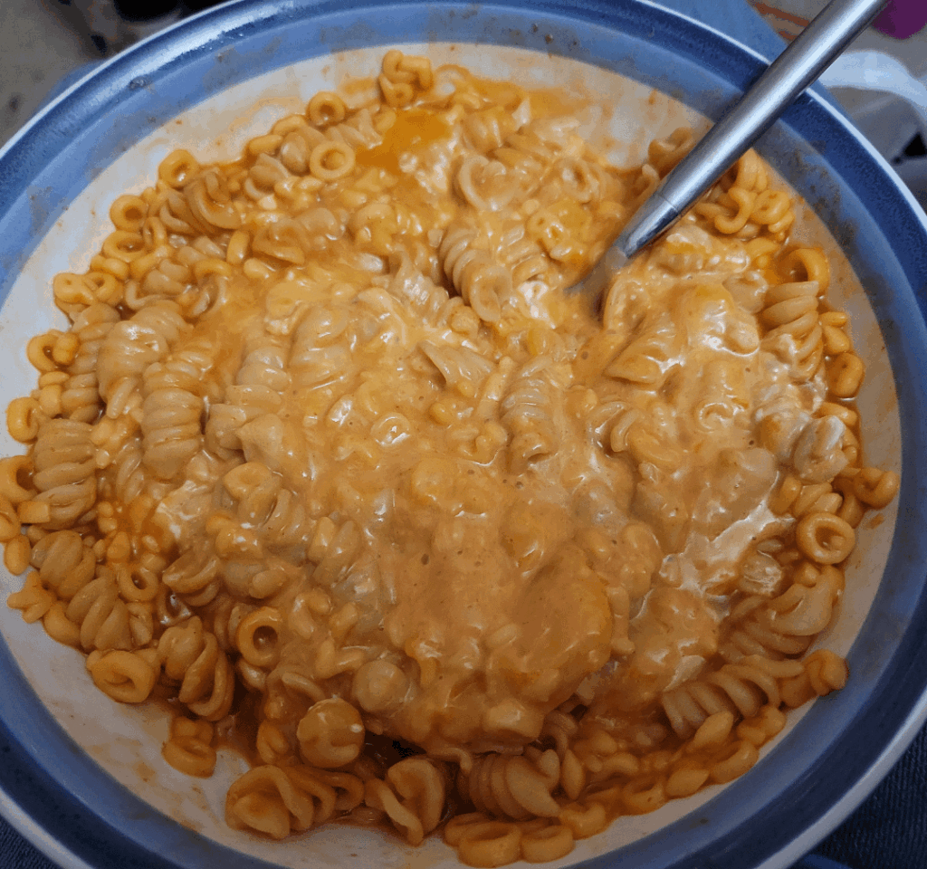 I like to melt cheddar on top of mixed pasta.