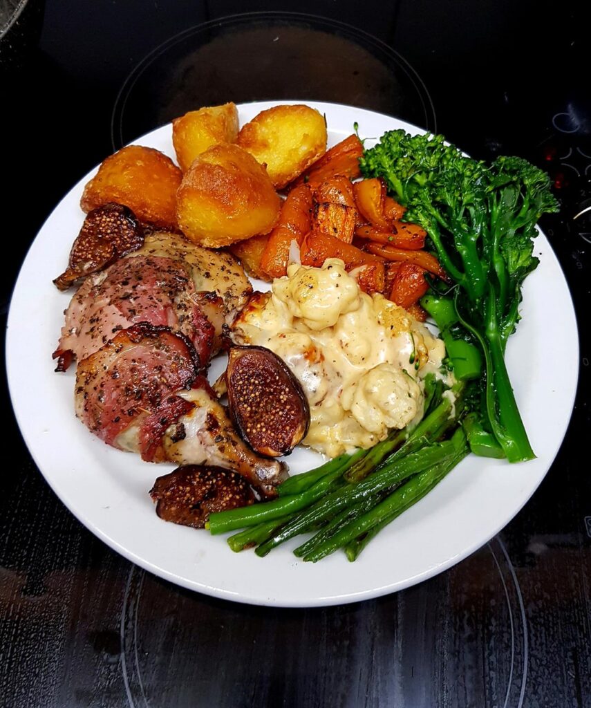 Roast Chicken Leg with Bacon and Figs, Duck Fat Potatoes, Glazed Carrots, Cauli Cheese, Sautéed Broccoli and Green Beans. White Wine Gravy.