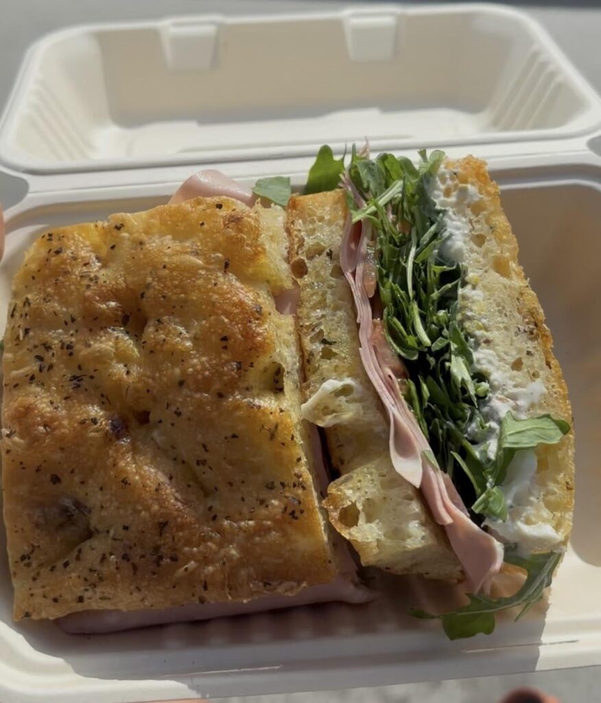 Pistachio mortadella, burrata, arugula, tomato, pistachio crumb, sun-dried tomato & basil focaccia