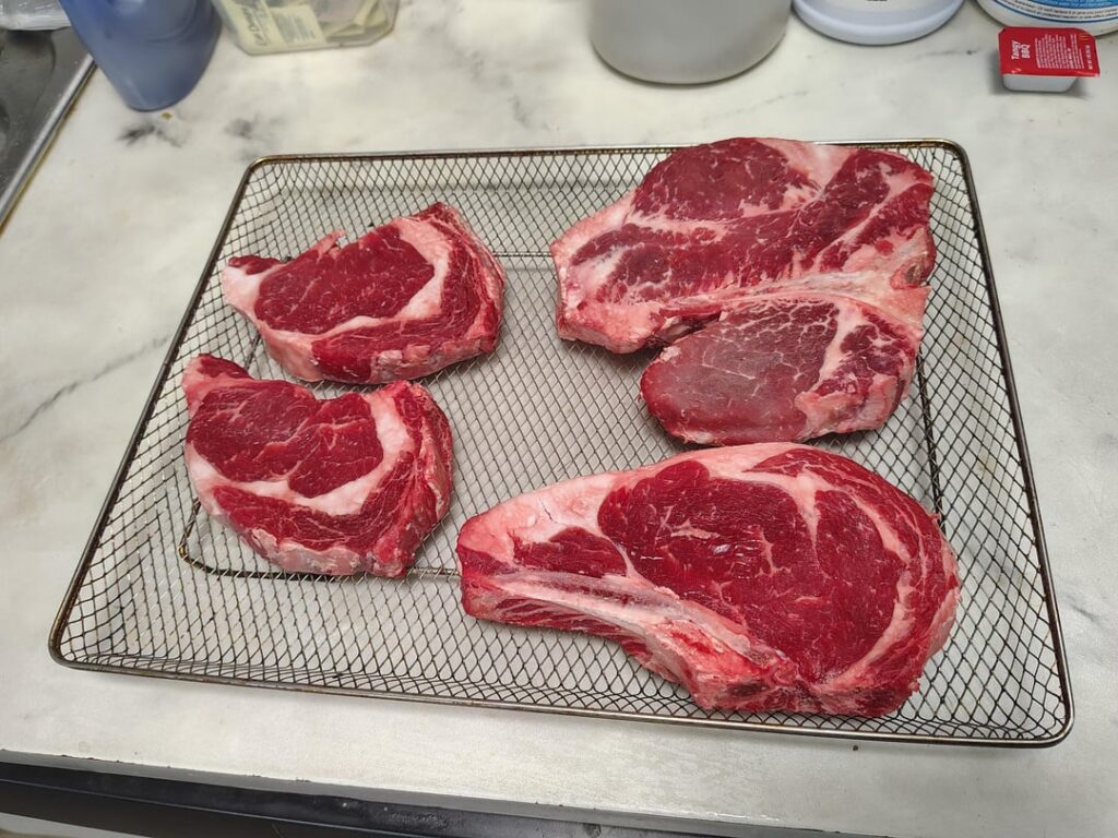 Hey reddit family say happy bday to my sister. Never cooked a porterhouse before so I did everyone else a ribeye.Split the porterhouse with my brother