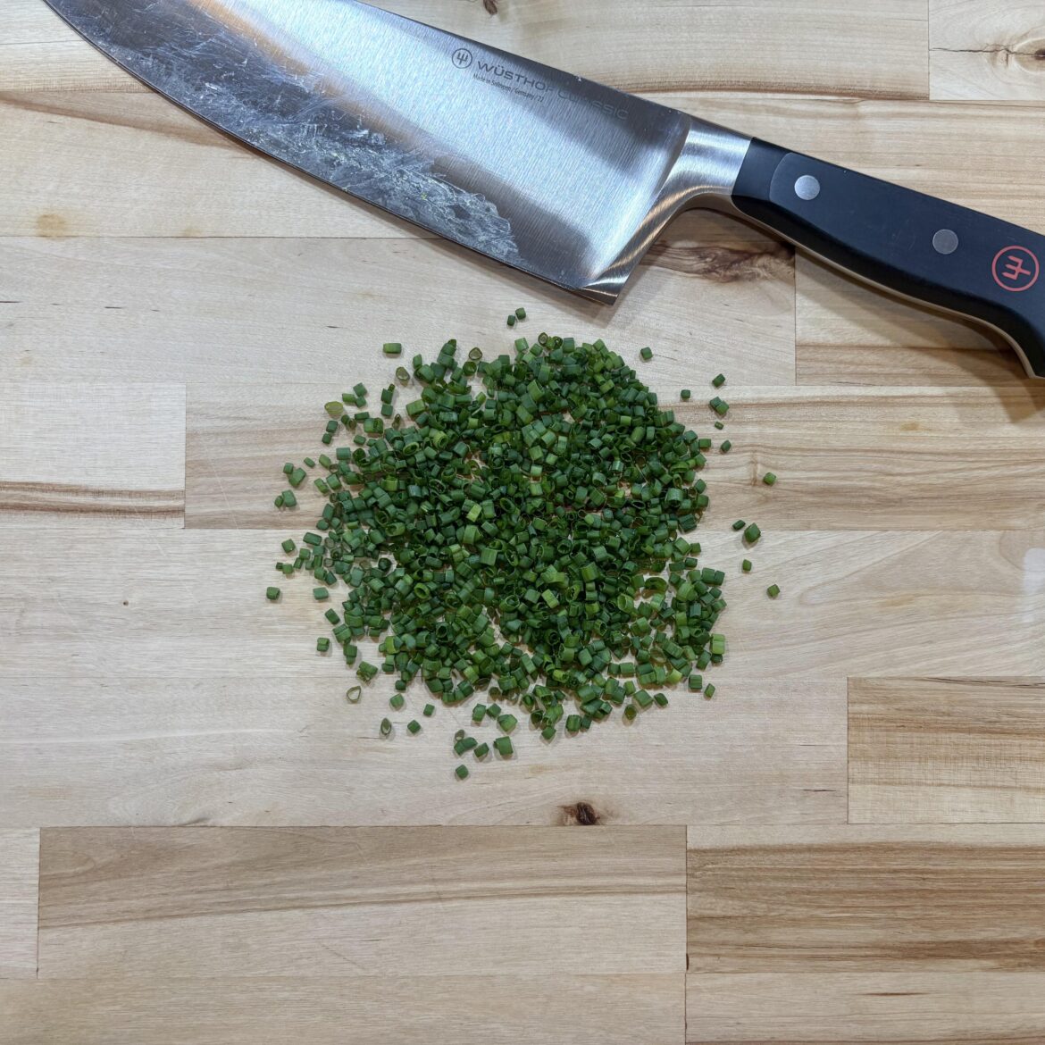 Cutting a few chives just this once.