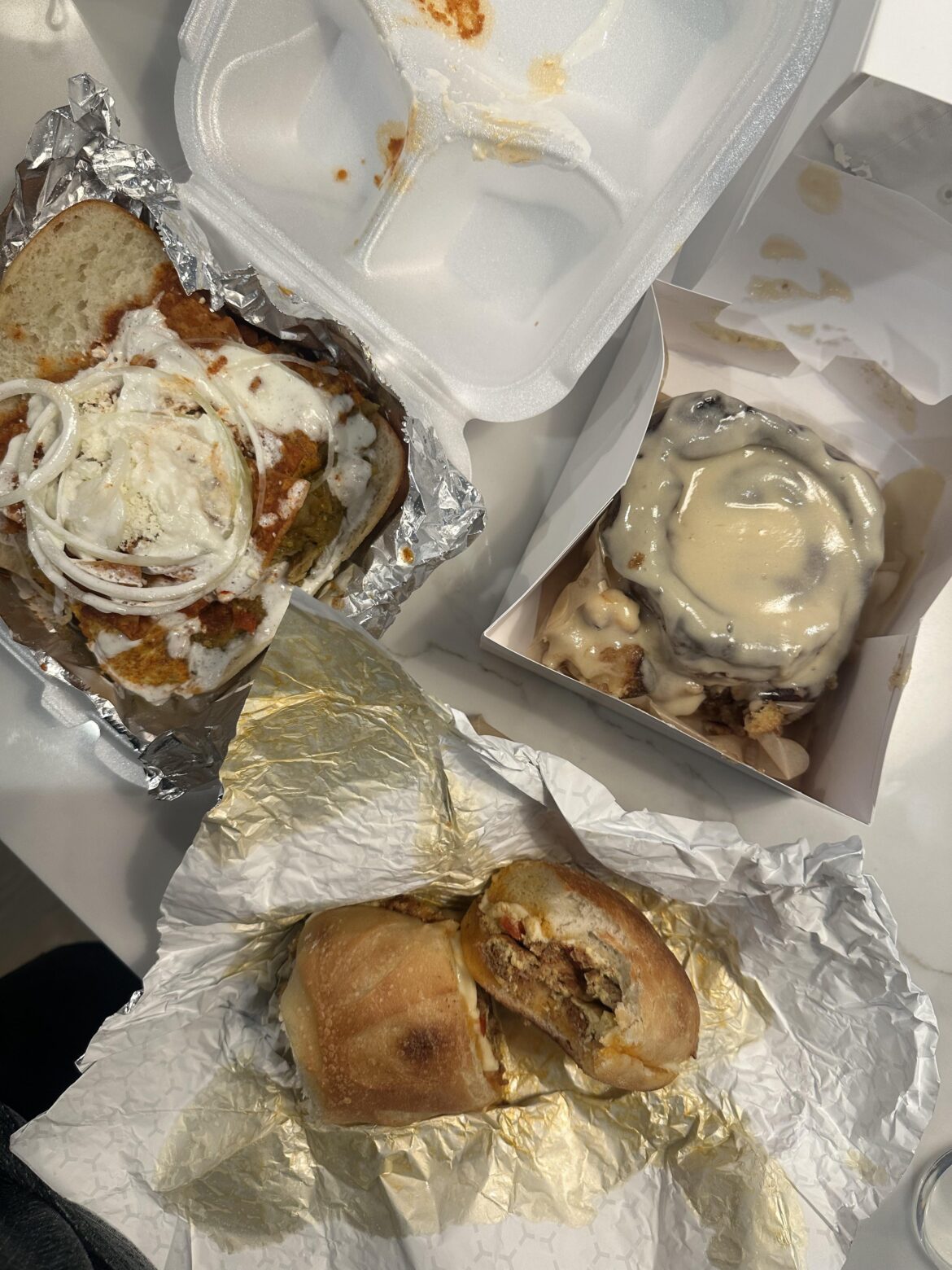Pan Artesanal cinnamon bun and chilaquiles sandwich, top tier