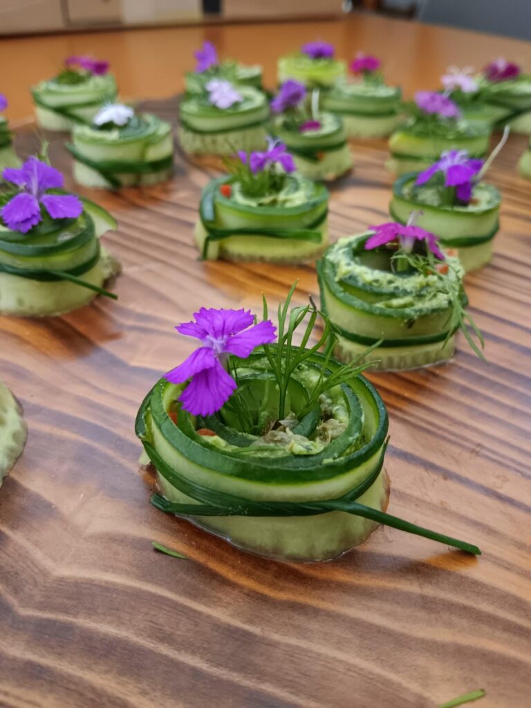 Cucumber roll- Vegan pesto hummus- Capers- Roasted red bell pepper- Dill- Chive