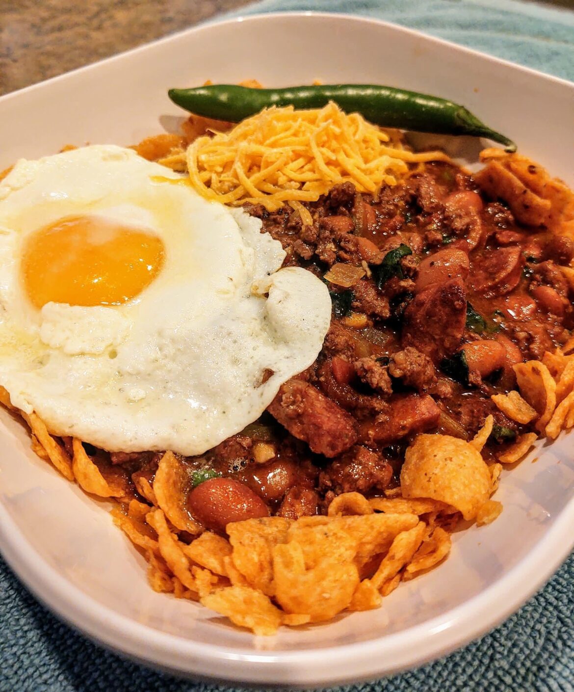 Antelope chili Frito pie with a perfect egg for breakfast this morning.