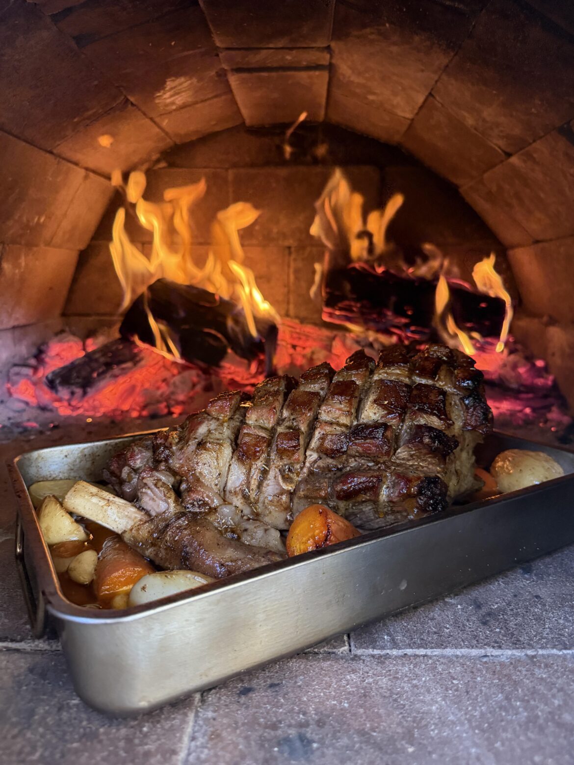 Lamb leg on a wood fire oven.