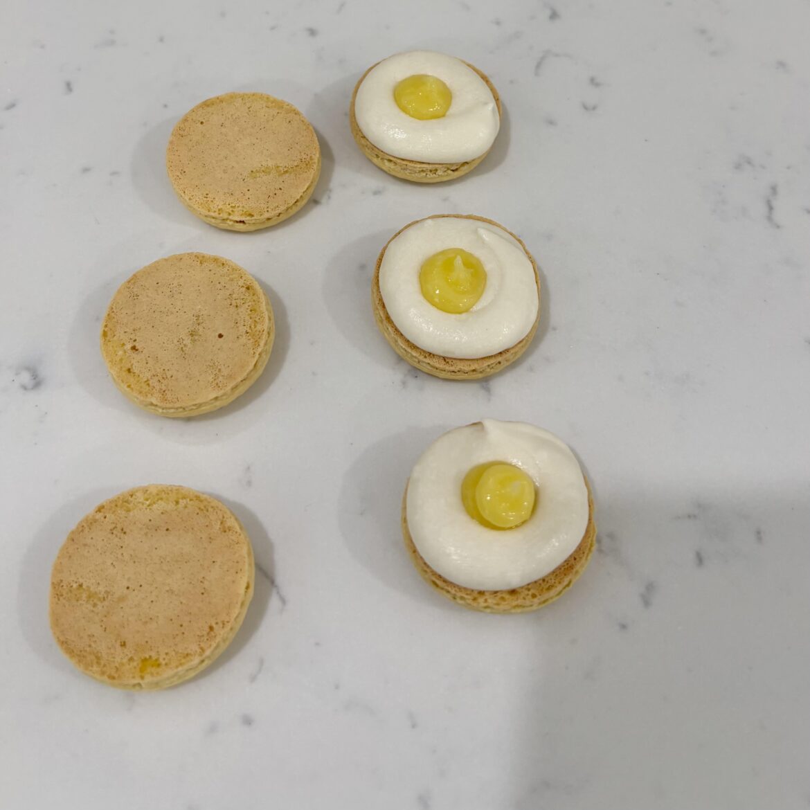 Lemon macarons just look like tiny sunny side up eggs