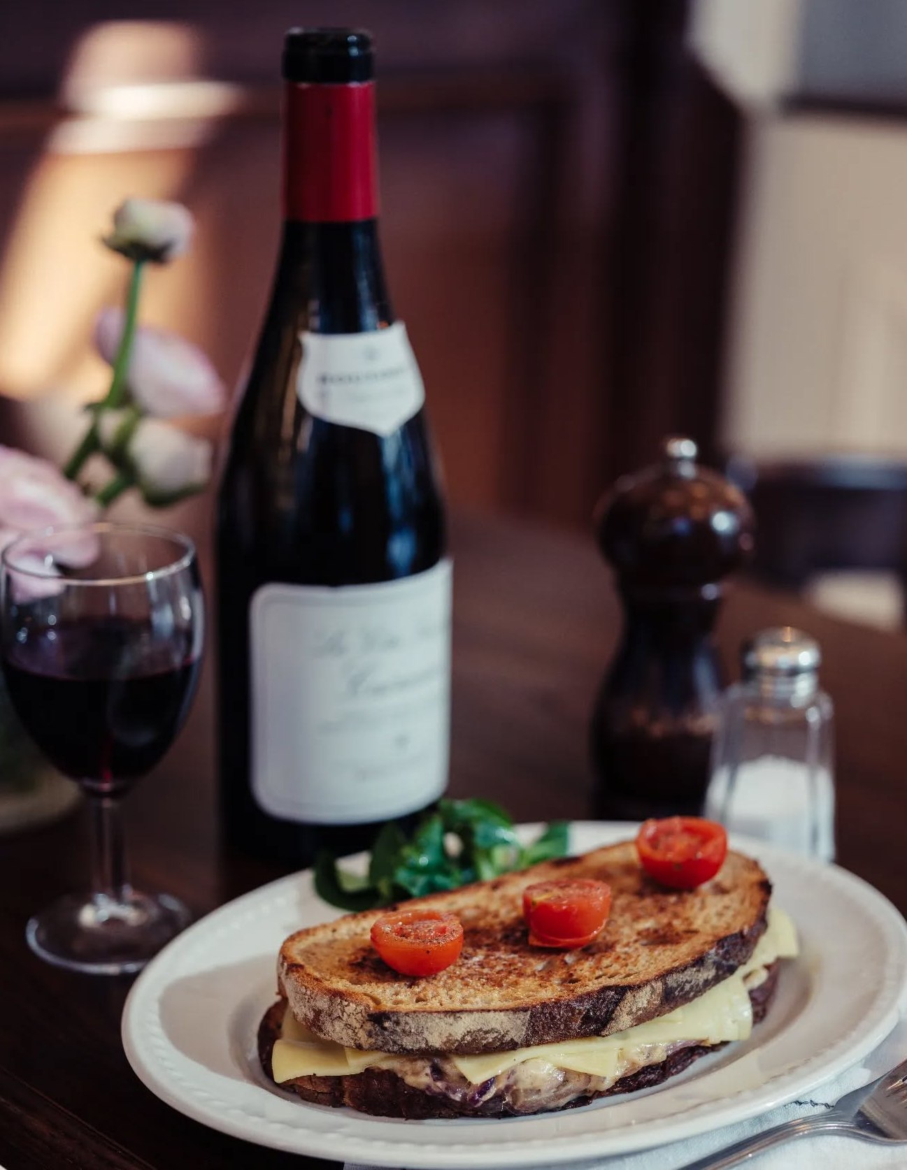 Chez Antoinette's Croque Monsieur with red wine.