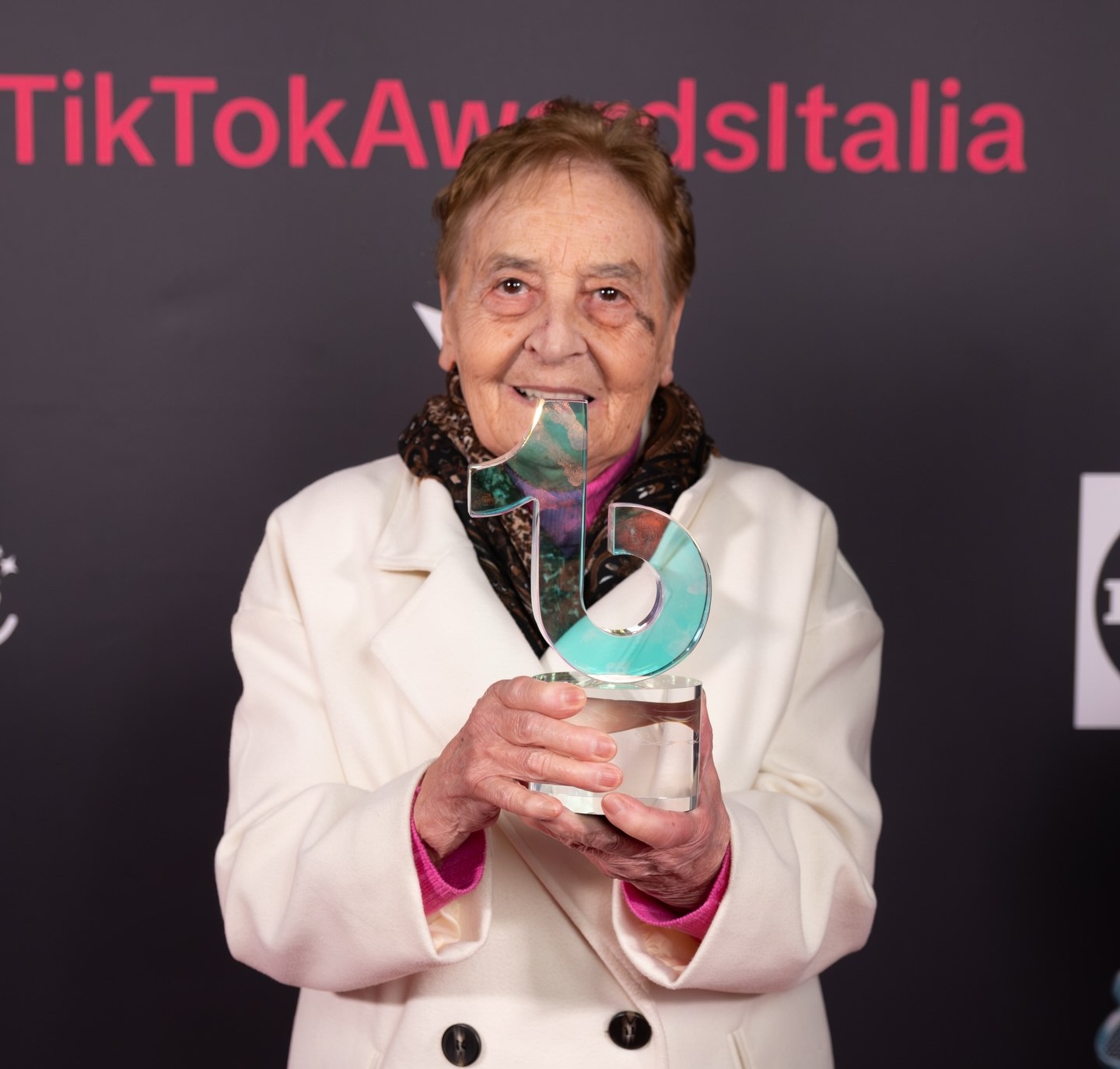 Nonna Silvi holding a TikTok award.