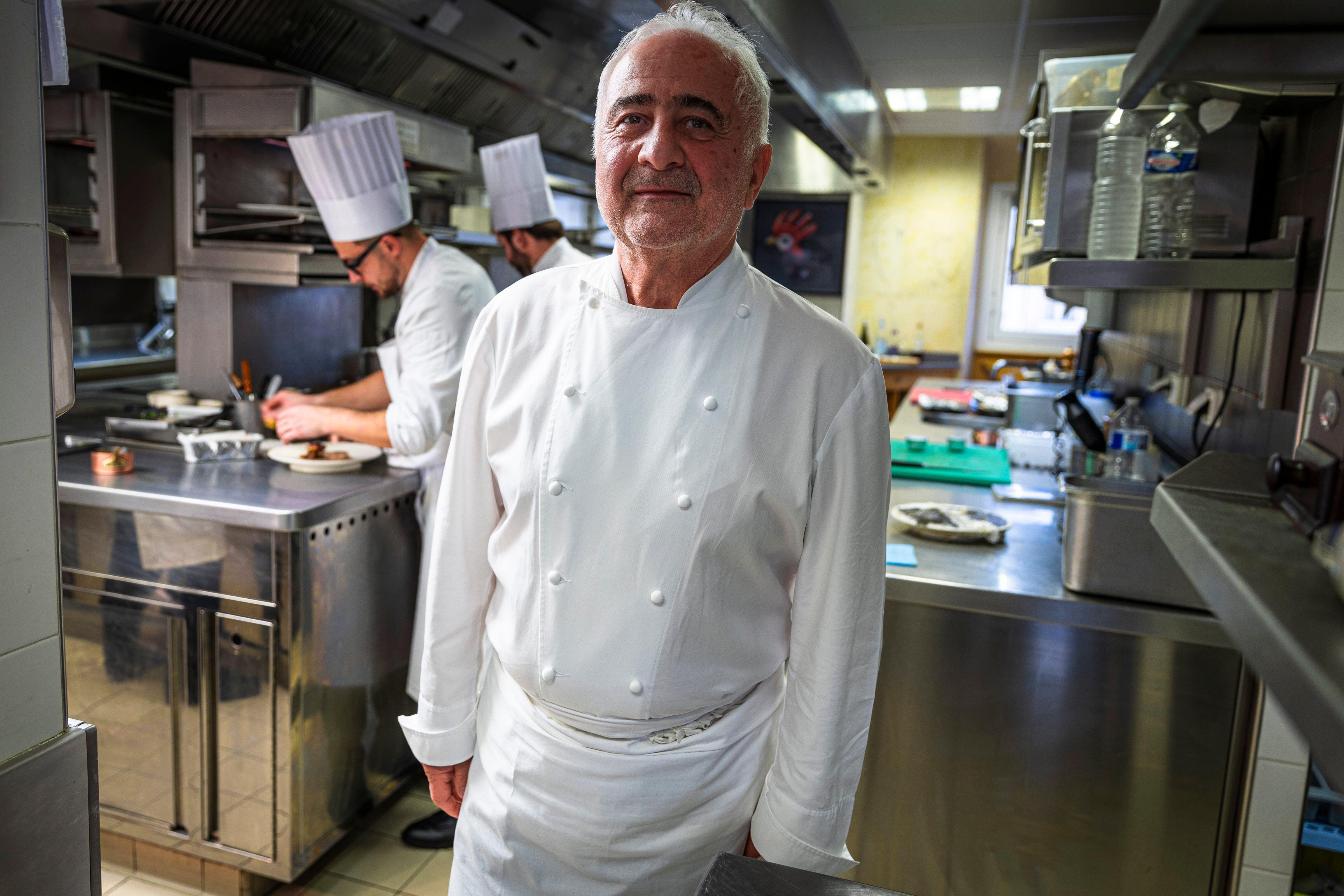 Guy Savoy, a French chef, standing in the kitchen of his eponymous restaurant.