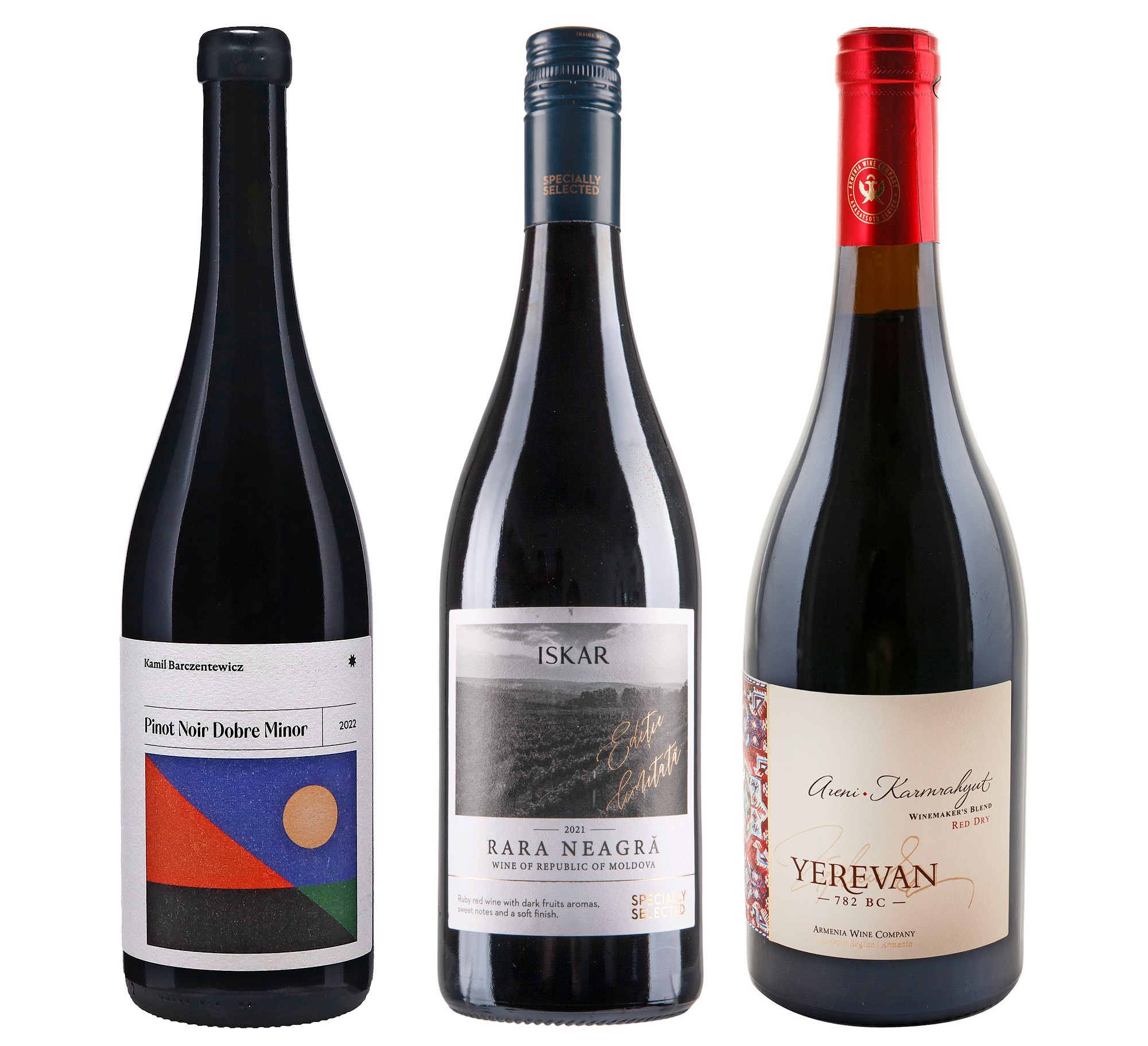 Three bottles of red wine. From left to right: Kamil Barczentewicz Pinot Noir Dobre Minor, Iskar Rara Neagră, and Yerevan Areni-Karmrahyut.