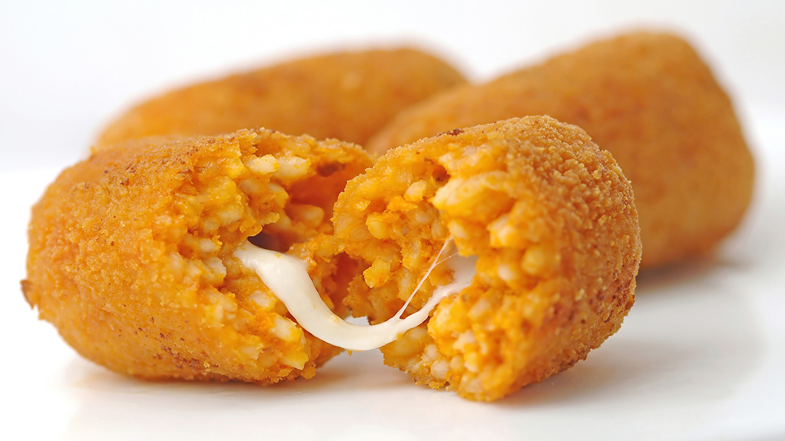 Supplì al telefono, fried rice croquettes with warm, melted mozzarella inside, are a favorite food in Rome. © izram18/iStock