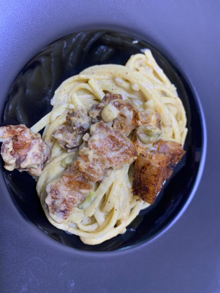 Pasta with pesto di pistachios and slow roasted pork