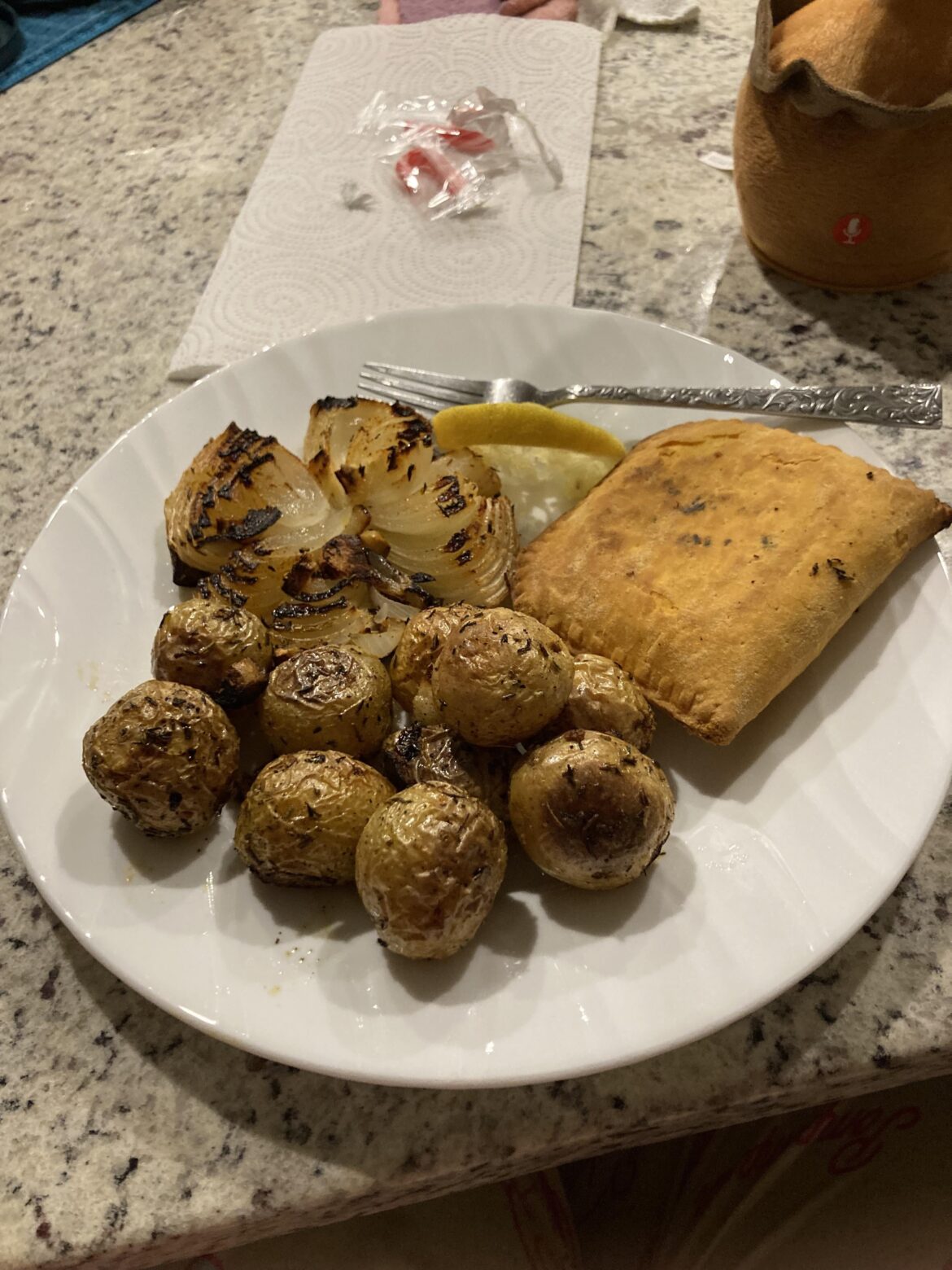 Jamaican spicy beef Patty with roasted potatoes and onion