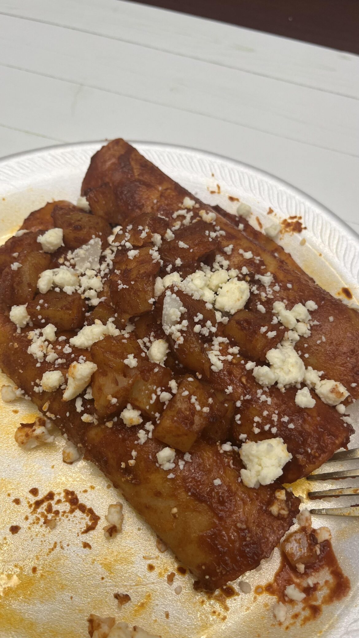 MIL made chile ancho sauce for her homemade queso fresco enchiladas con papas 🤤