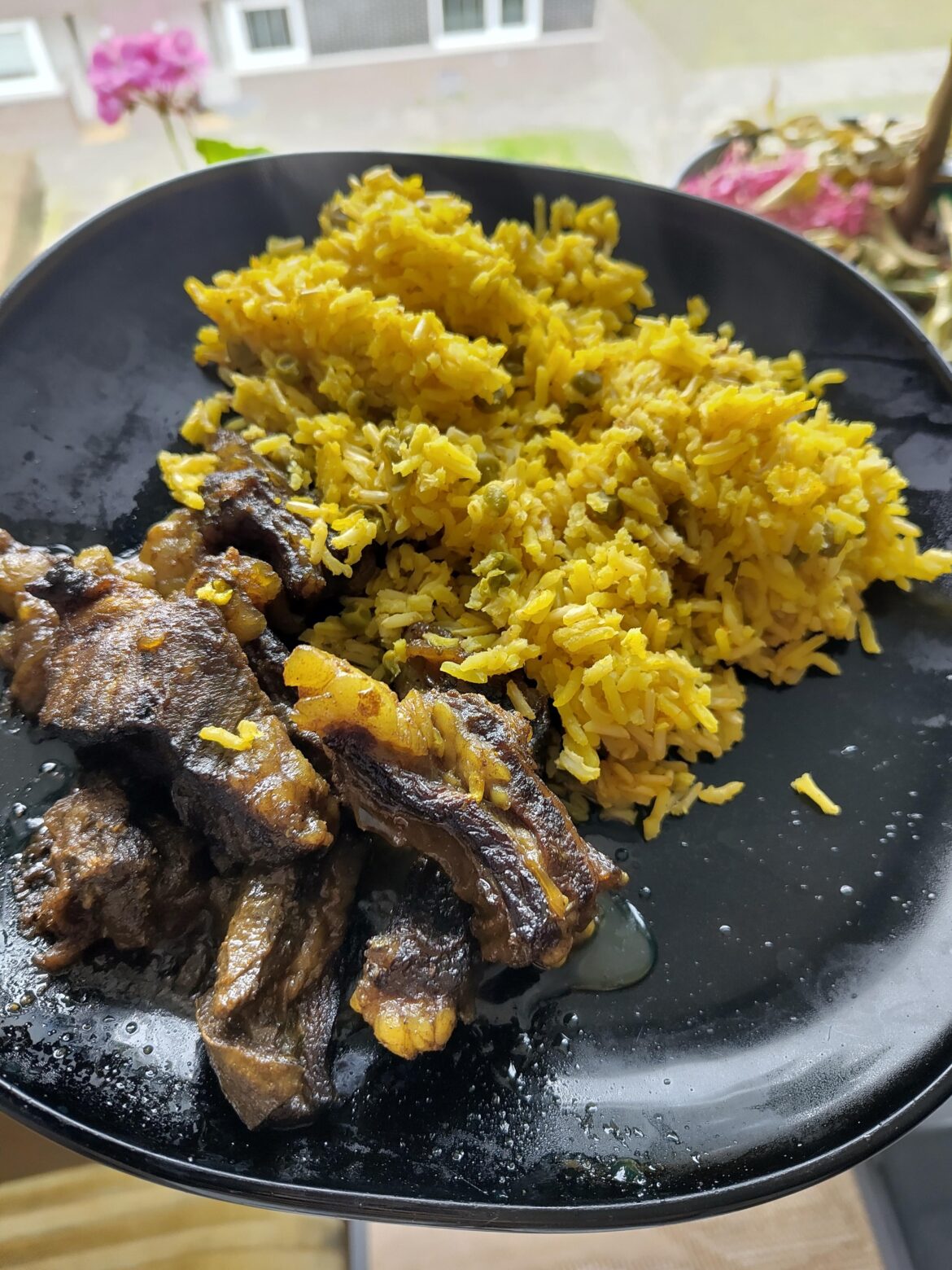 Goat curry and yellow rice