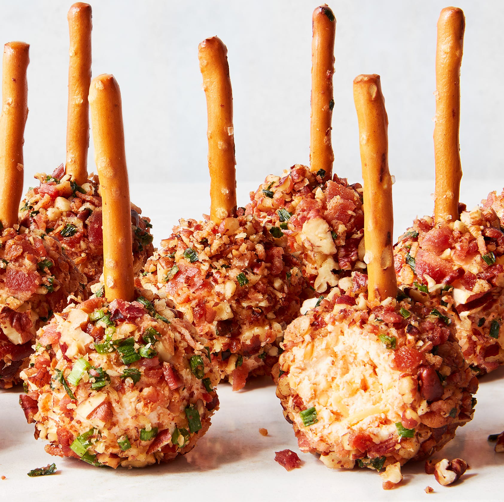 cheese ball bites with pretzel sticks