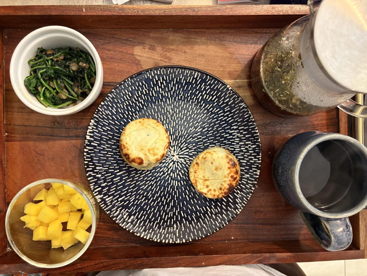 Sous vide egg bites, spinach w/ garlic and onions, mango, green tea