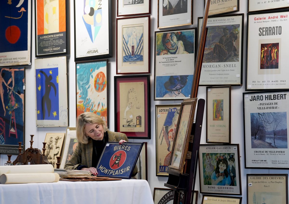 Catherine Southon of Catherine Southon Auctioneer's in Chislehurst, Kent, amongst items from London's oldest family run French restaurant, Mon Plaisir, which is auctioning off their classic interior decorations to make way for a new look. Mon Plaisir in Covent Garden, usually adorned with a large tricolour flag, has served up "great food" and "rude" waitstaff for over 80 years. Picture date: Monday December 22, 2025.