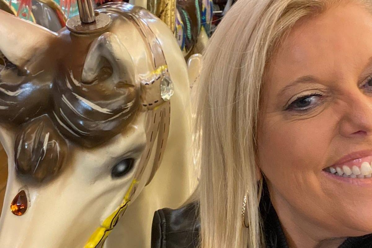 Claire selfie with a fairground horse