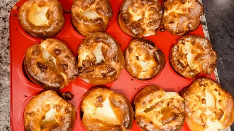 Handout Image shows red tray of Yorkshire puddings.