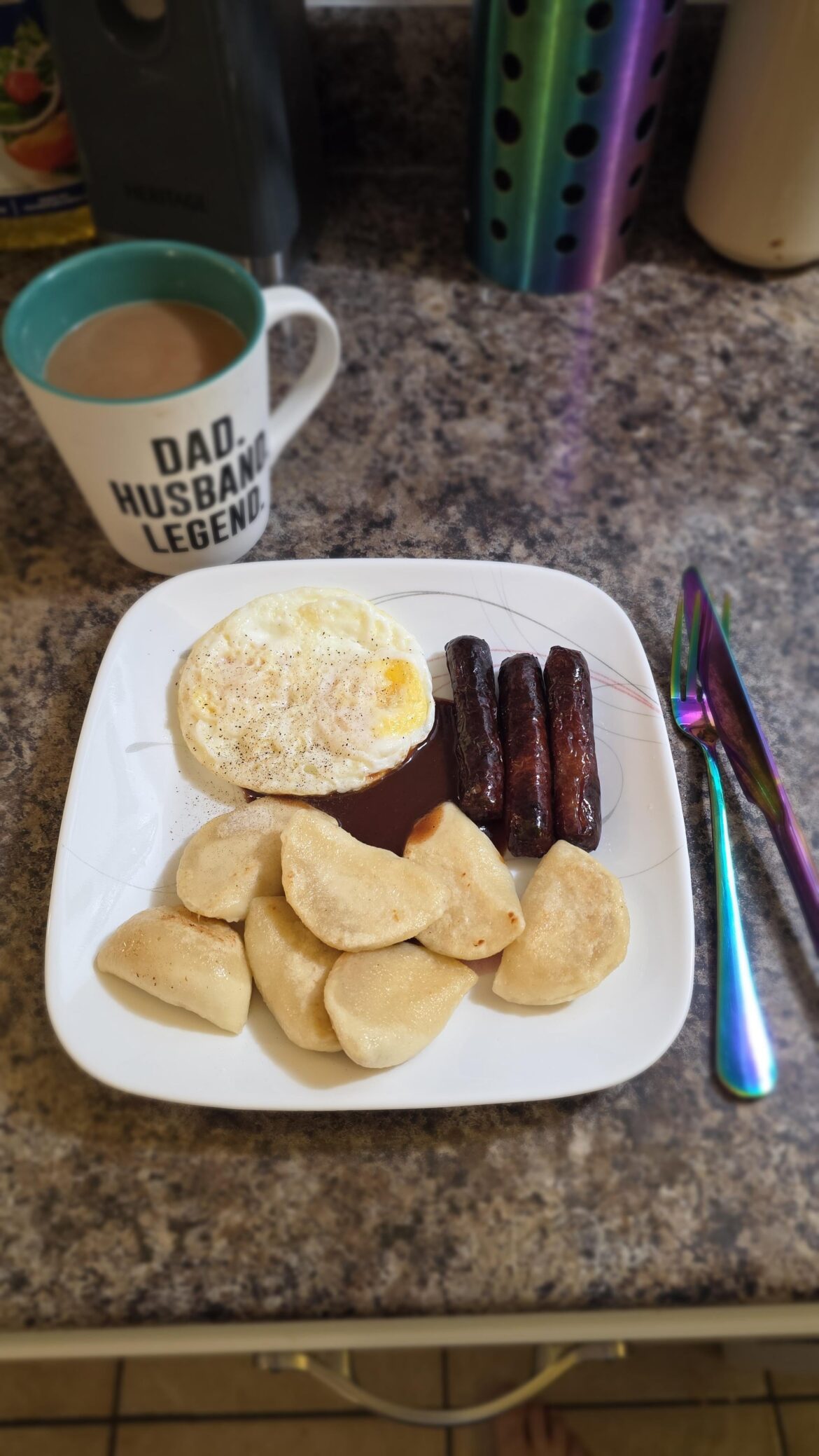 Cottage cheese perogies, lightly fried with sausage and two eggs. Dash of pepper and a dollop of HP sauce.