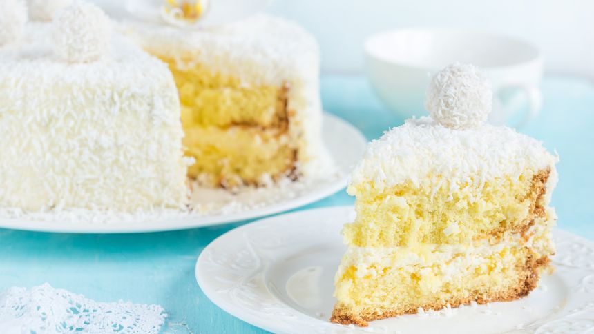 piece of festive lemon and coconut sponge cake, selective focus