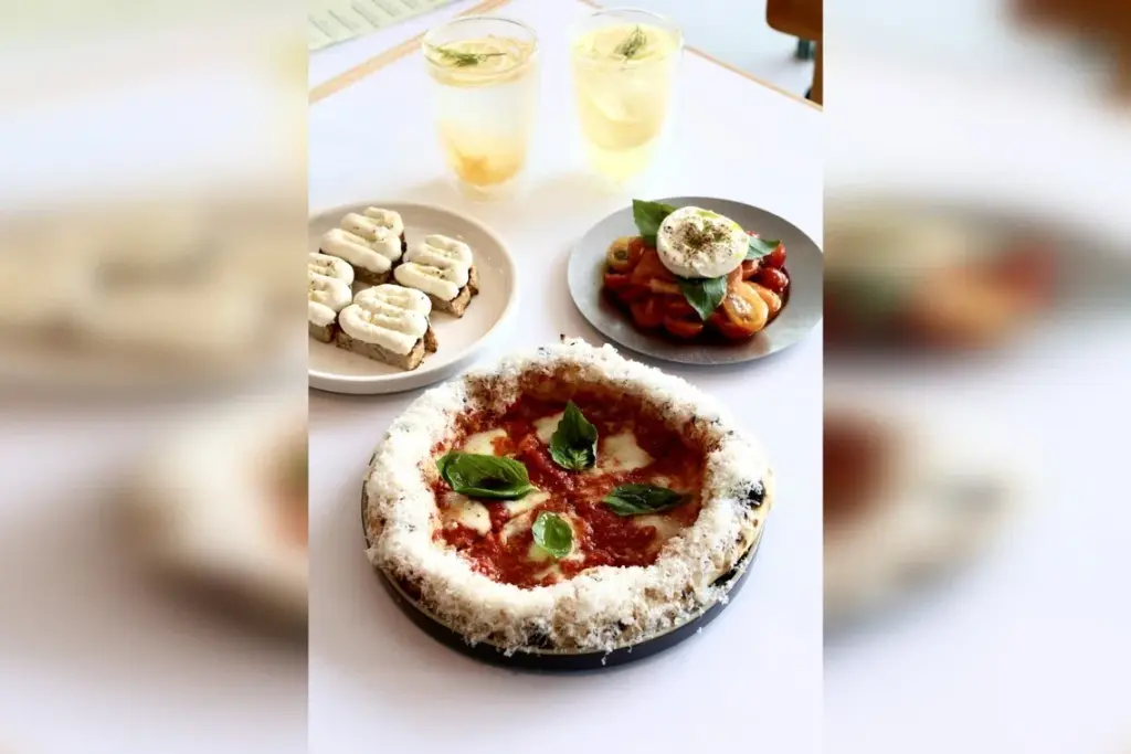 (Clockwise from top left) Sparkling Yuzu, Sparkling Lemonade, Burrata Tomato Salad, Margherita and Ricotta Crostini.