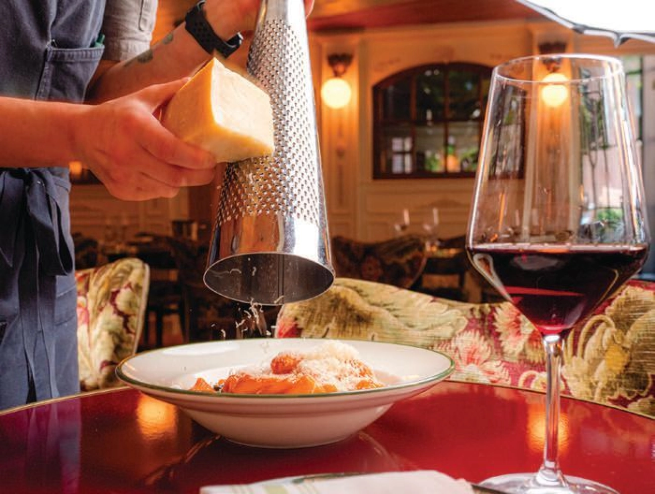 Fresh parmesan is generously served over a bowl of warm pasta PHOTO BY ASSEMBLY DESIGN STUDIO