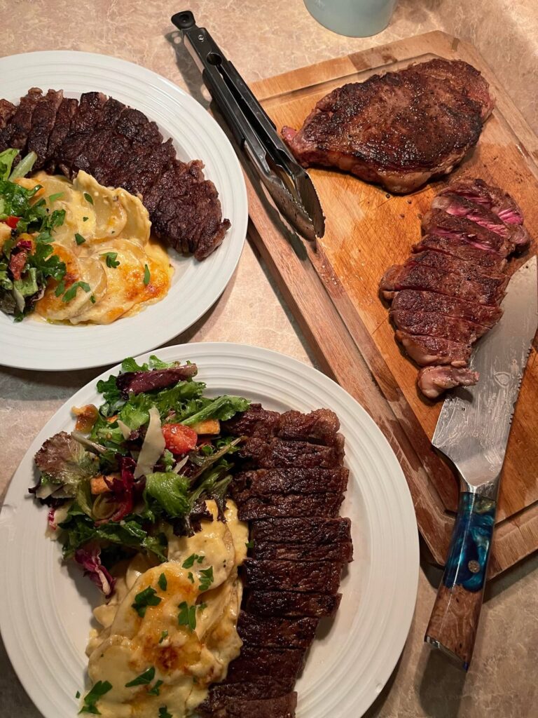 [homemade] NY strips, potatoes au gratin, spring mix salad and vinaigrette
