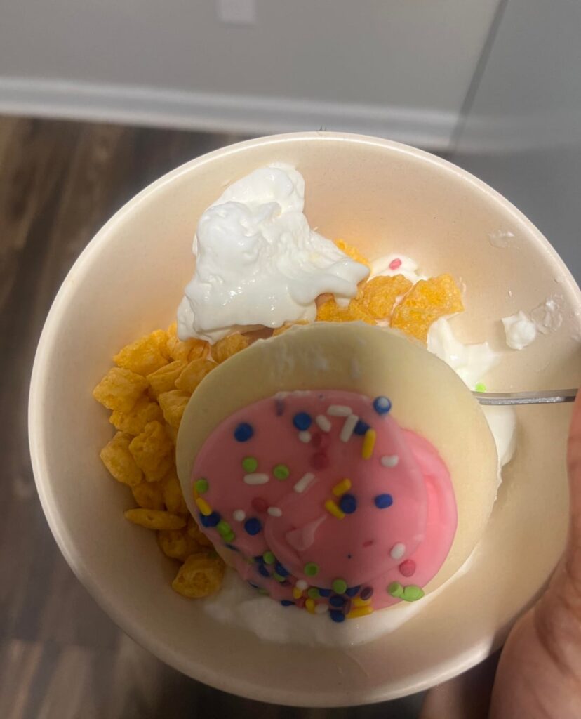 Frosted sugar cookie with vanilla Greek yogurt & captain crunch :-) dollop of whipped cream 295 calories :-)