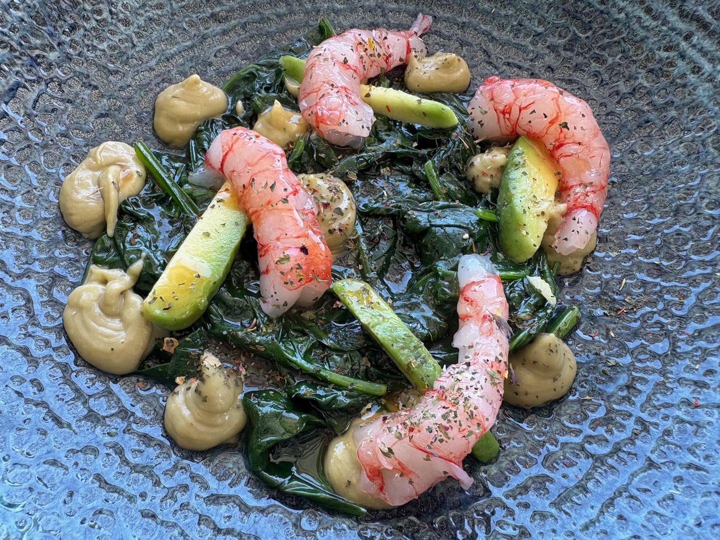 Red shrimp crudo with Sicilian avocado on sauteed spinach with a grapefruit reduction, served at Portocostanza, a stylish restaurant overlooking the port in Palermo.