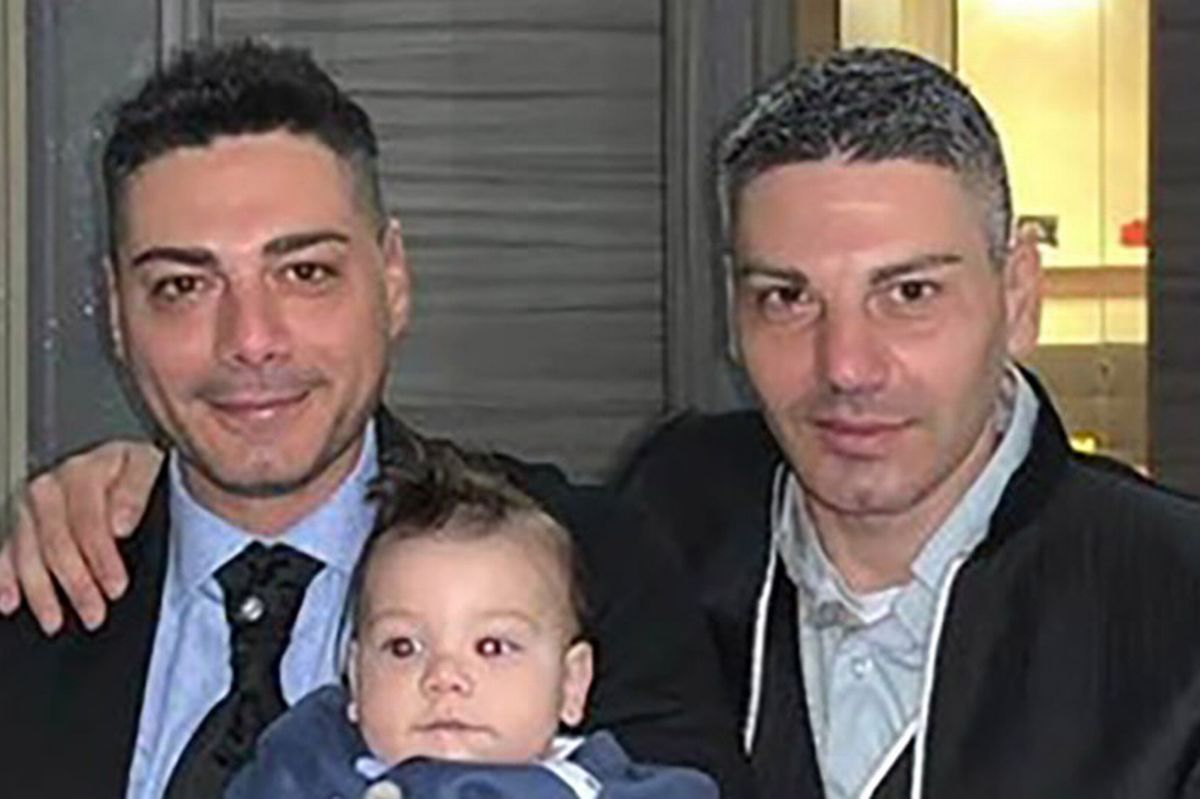 Giovanni Lopez with his brother and a child