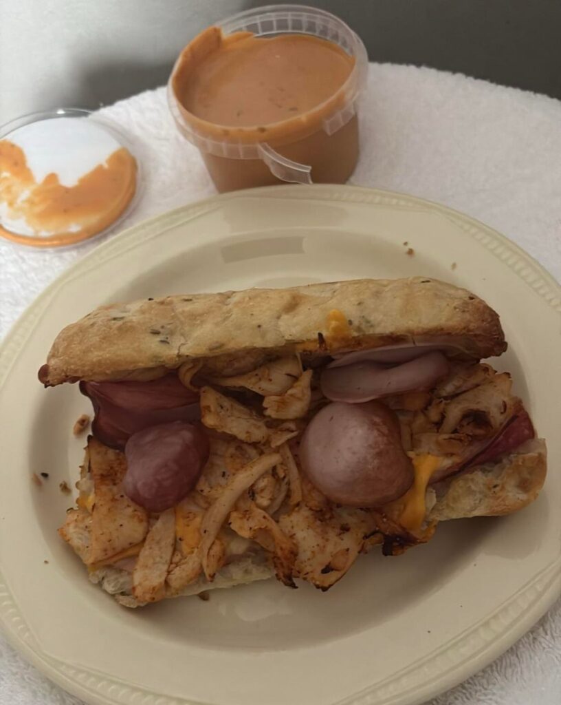 Danish Salami, Garlic Sausage, Shredded Chicken seasoned w/ Hot Nashville seasoning, w/ Red Cheddar & Mozzarella, on a toasted Rosemary & Sea Salt Panini! (Southwest Sauce on the side).