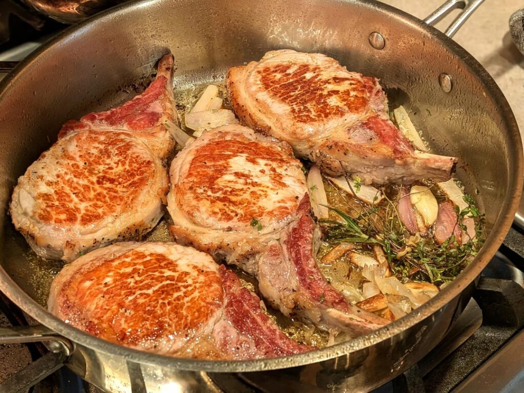 Pork chops w/ pan sauce over polenta