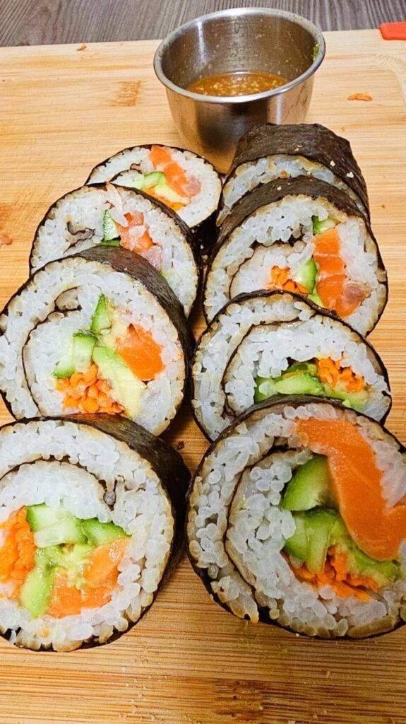 Homemade sushi rolls packed with fresh veggies and salmon.