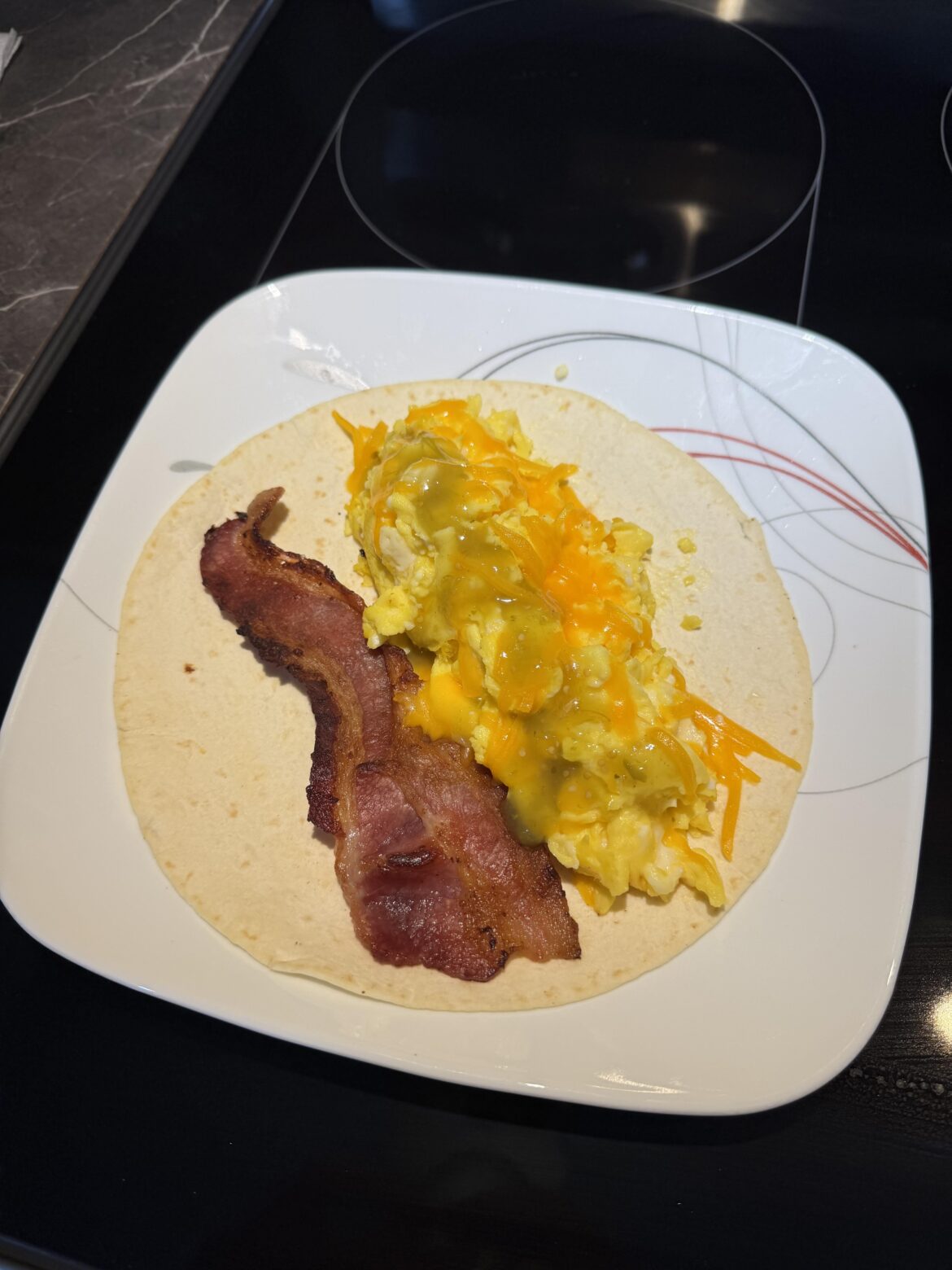 Bacon, egg, cheese, salsa verde breakfast taco