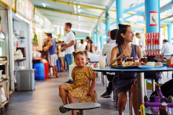 Singapore’s hawker centres are child- friendly.