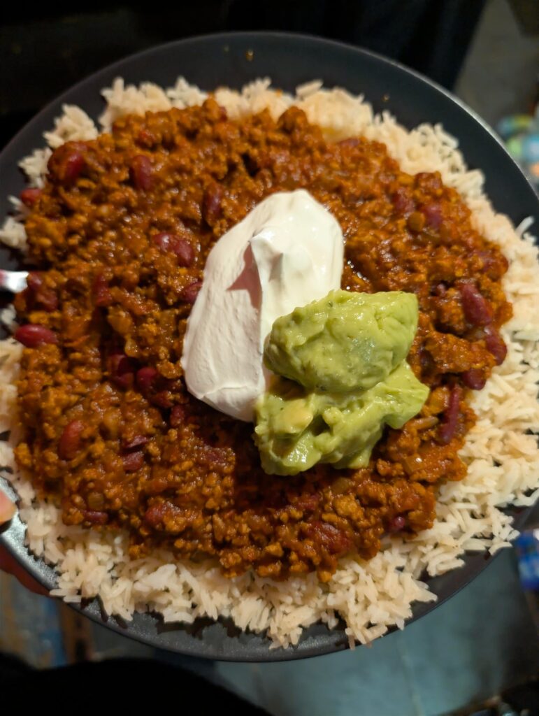 Last night's dinner - homemade chilli con carne with sour cream and guacamole