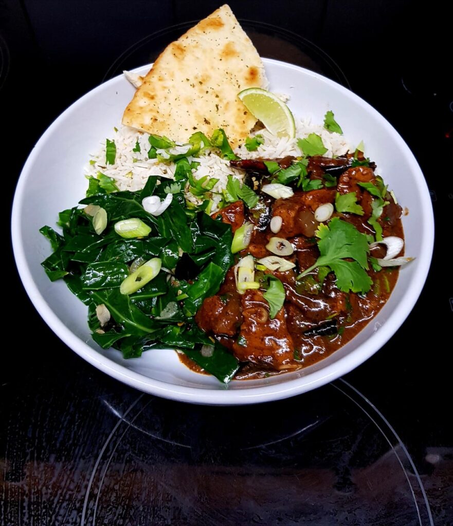 Sri Lankan Black Pork Curry, Roasted Coconut Rice, Mullung (Greens w Spices) and Bread.