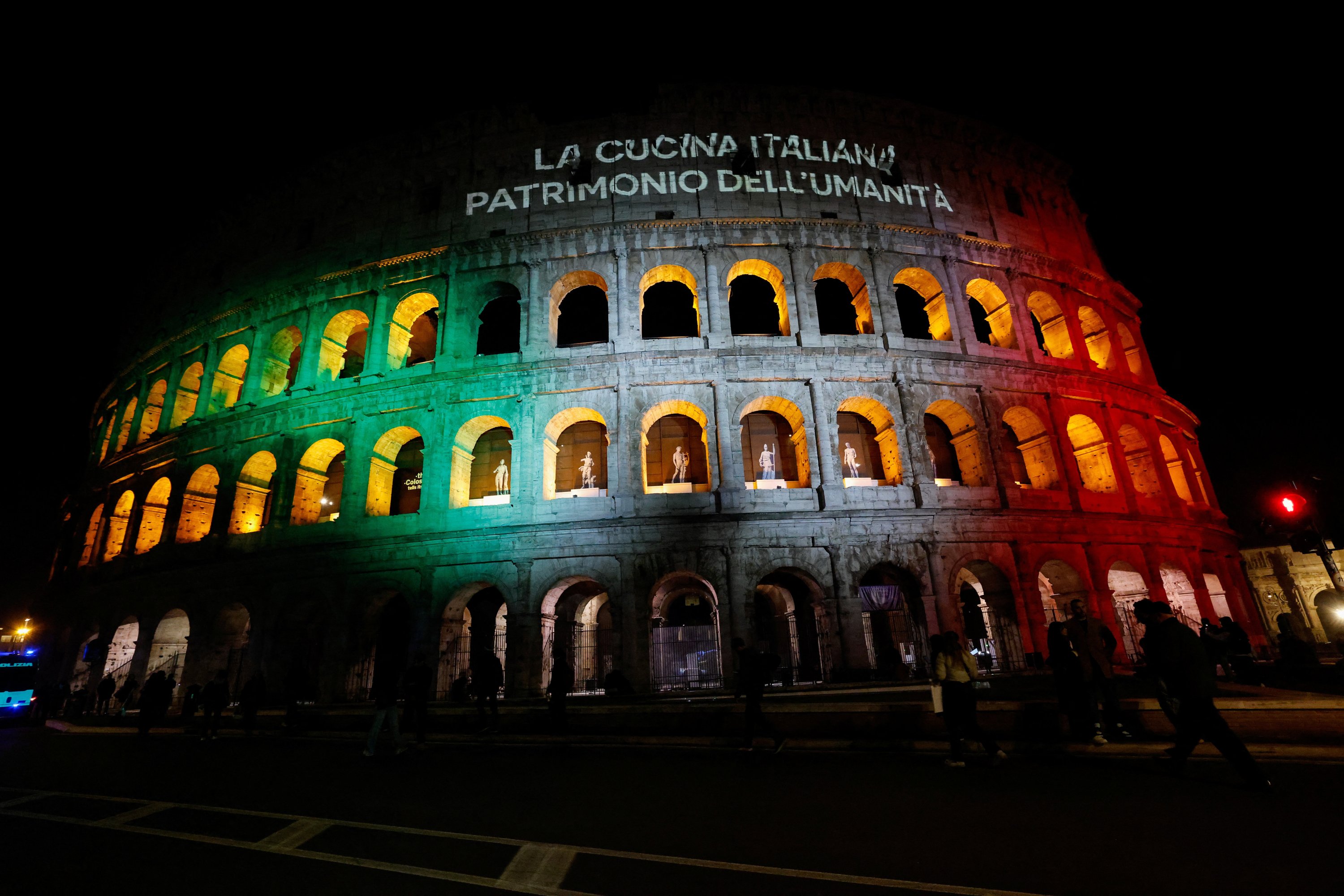 The Colosseum is illuminated during a special light installation, after Italy won a place on UNESCO's cultural heritage list for its culinary traditions, in Rome, Italy, Dec. 10, 2025. (Reuters Photo)