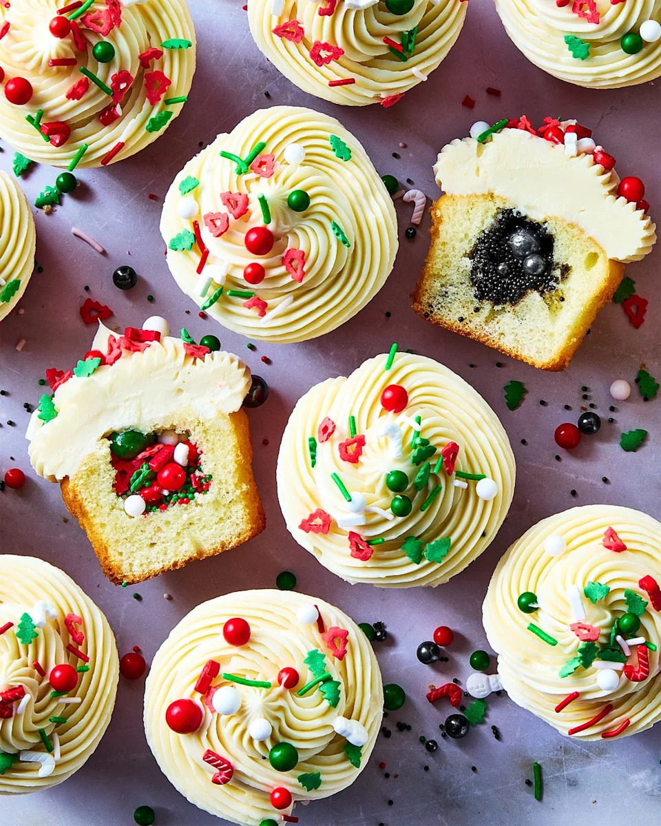 cupcakes decorated with christmas sprinkles and filled with either more christmas sprinkles for nice or black sprinkles for naughty