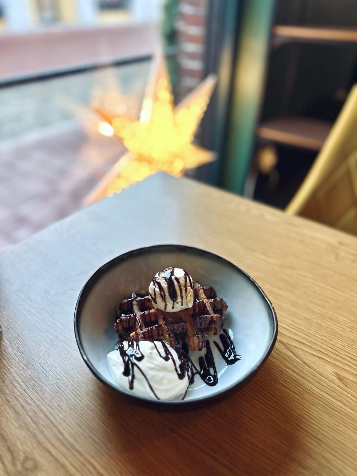 warm Belgian waffle with ice cream and whipped cream
